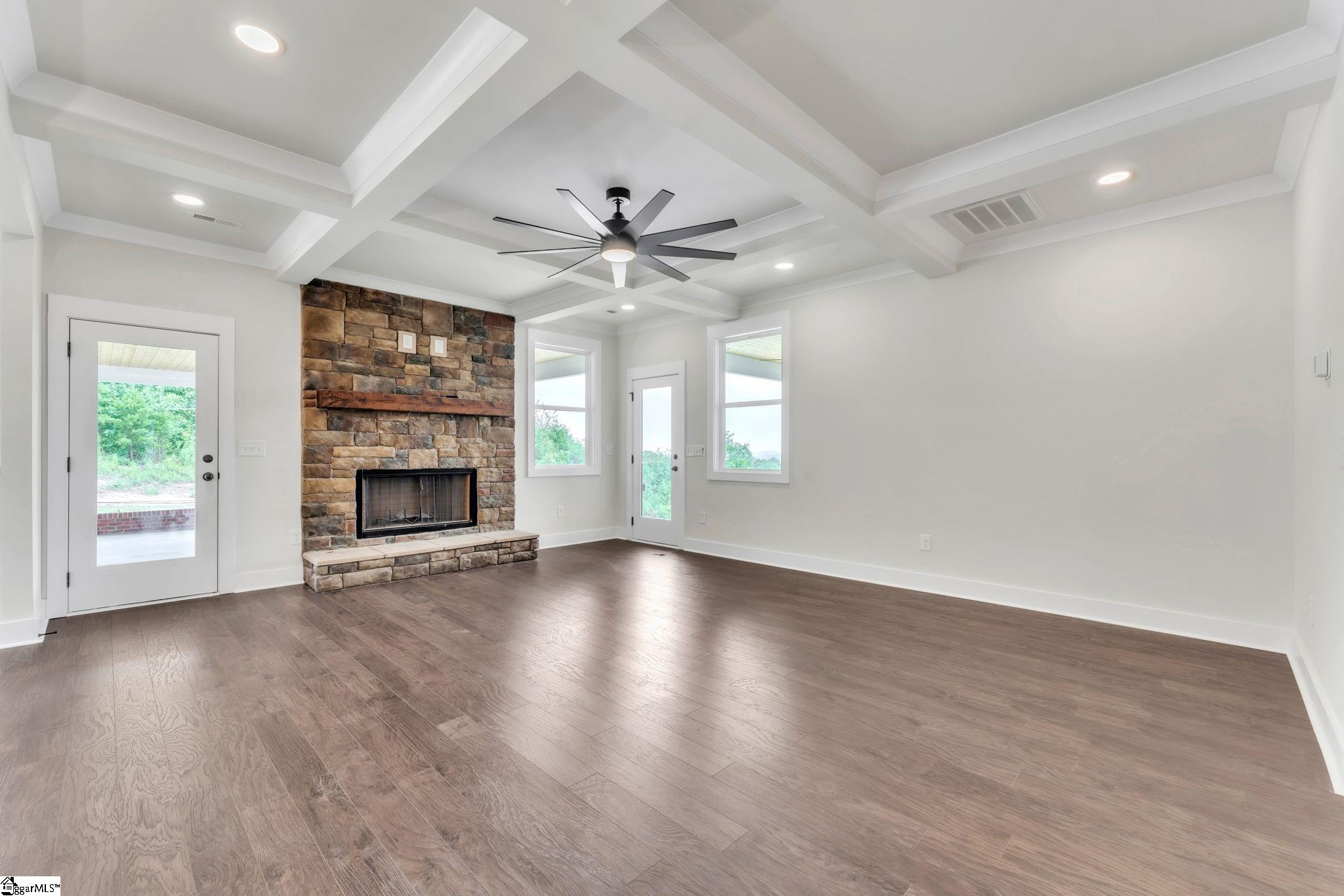 452 North Glassy Mountain Road Landrum, SC 29356 - Photo 21 of 46 stone fireplace, coffer ceiling