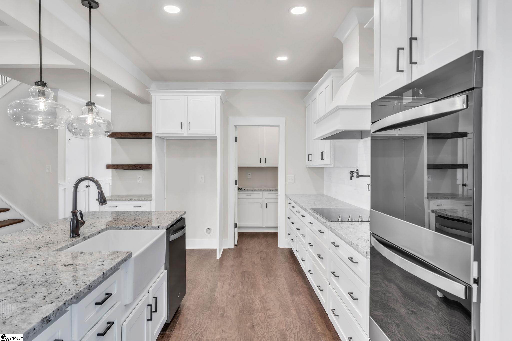 452 North Glassy Mountain Road Landrum, SC 29356 - Photo 24 of 46 butlers pantry with cabinets and granite counters and under cabinet lighting