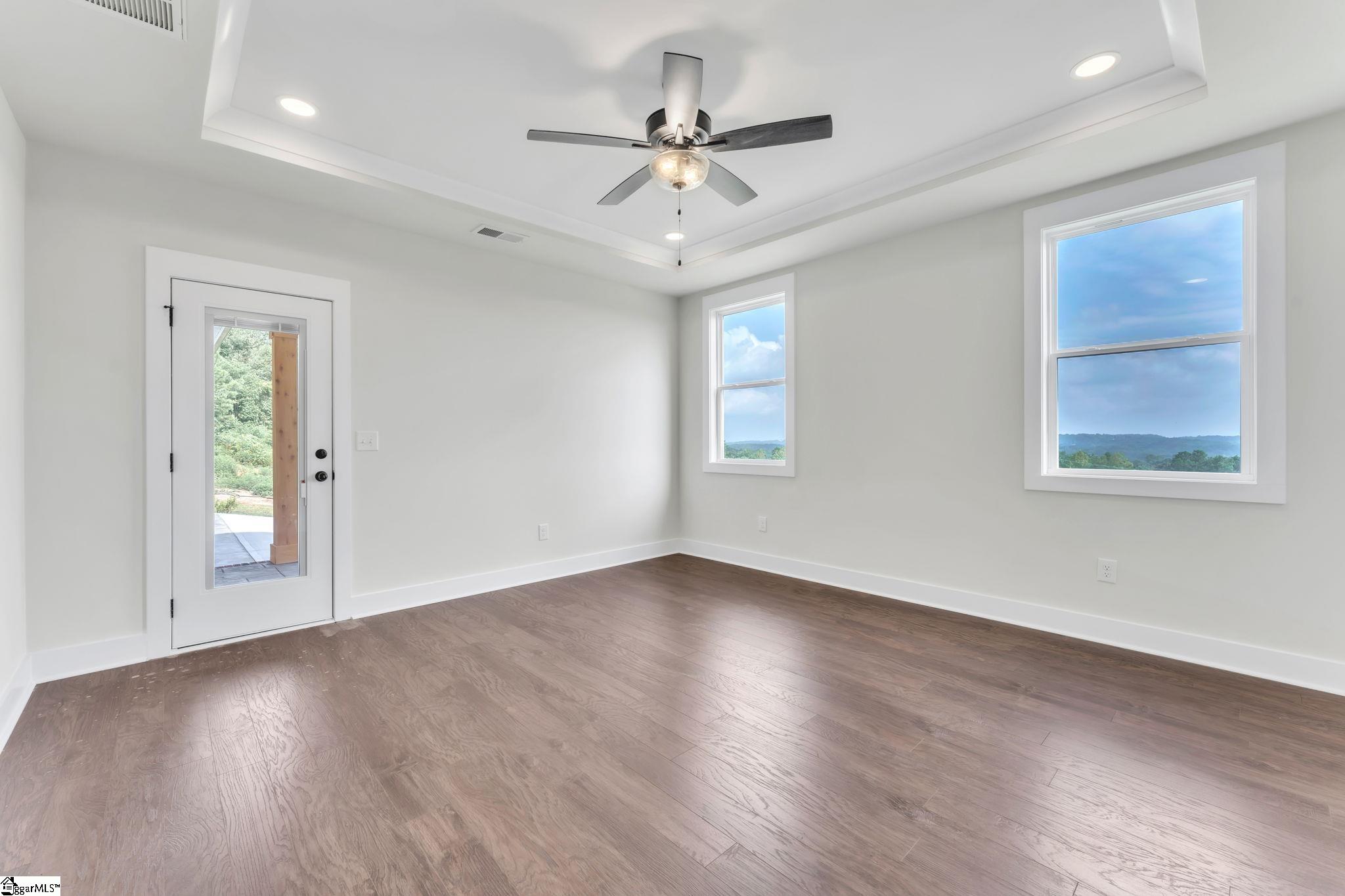 452 North Glassy Mountain Road Landrum, SC 29356 - Photo 29 of 46 trey ceiling, LVP flooring, access to back porch, valley views