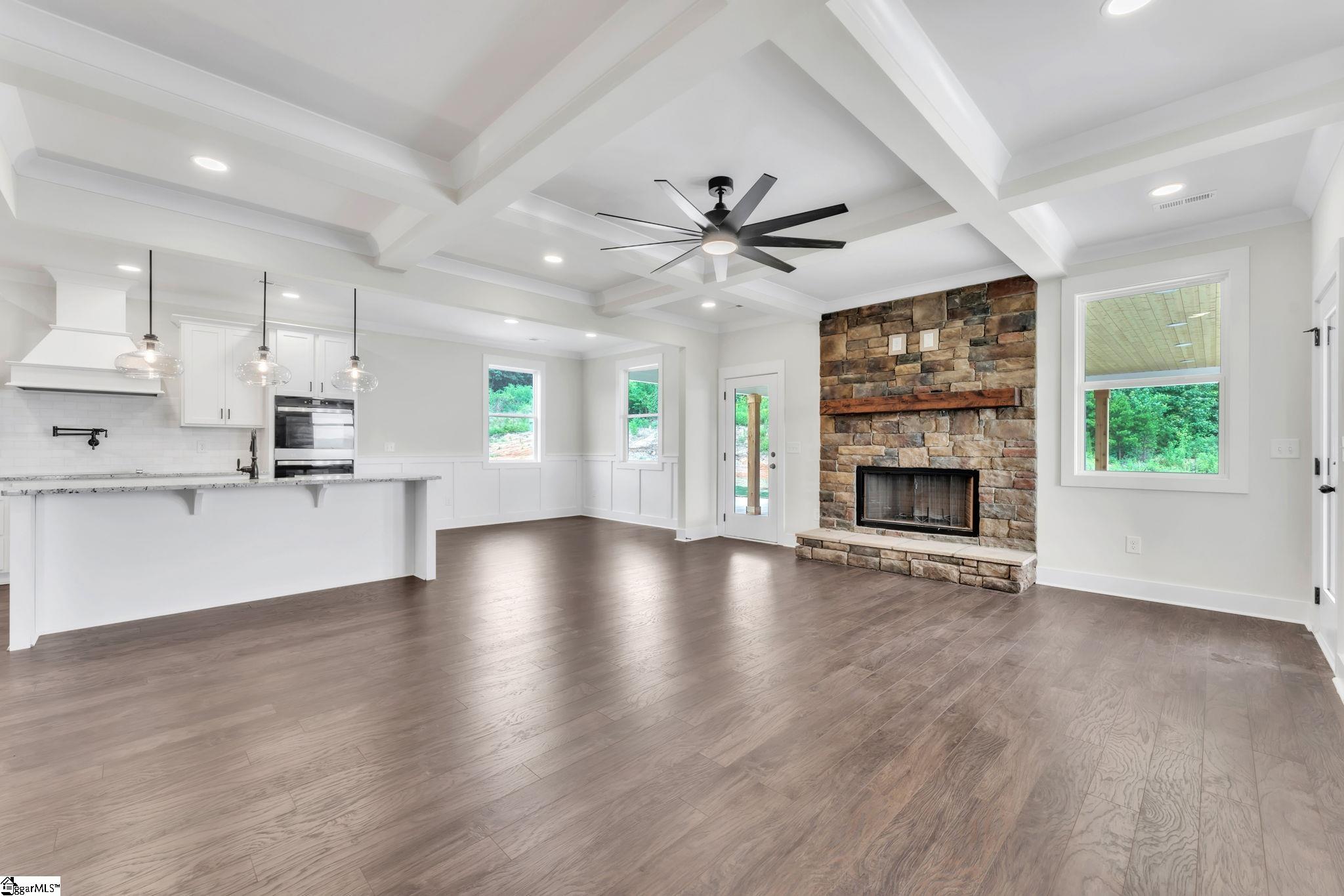 452 North Glassy Mountain Road Landrum, SC 29356 - Photo 6 of 46 coffer ceiling, stone fireplace, granite top island