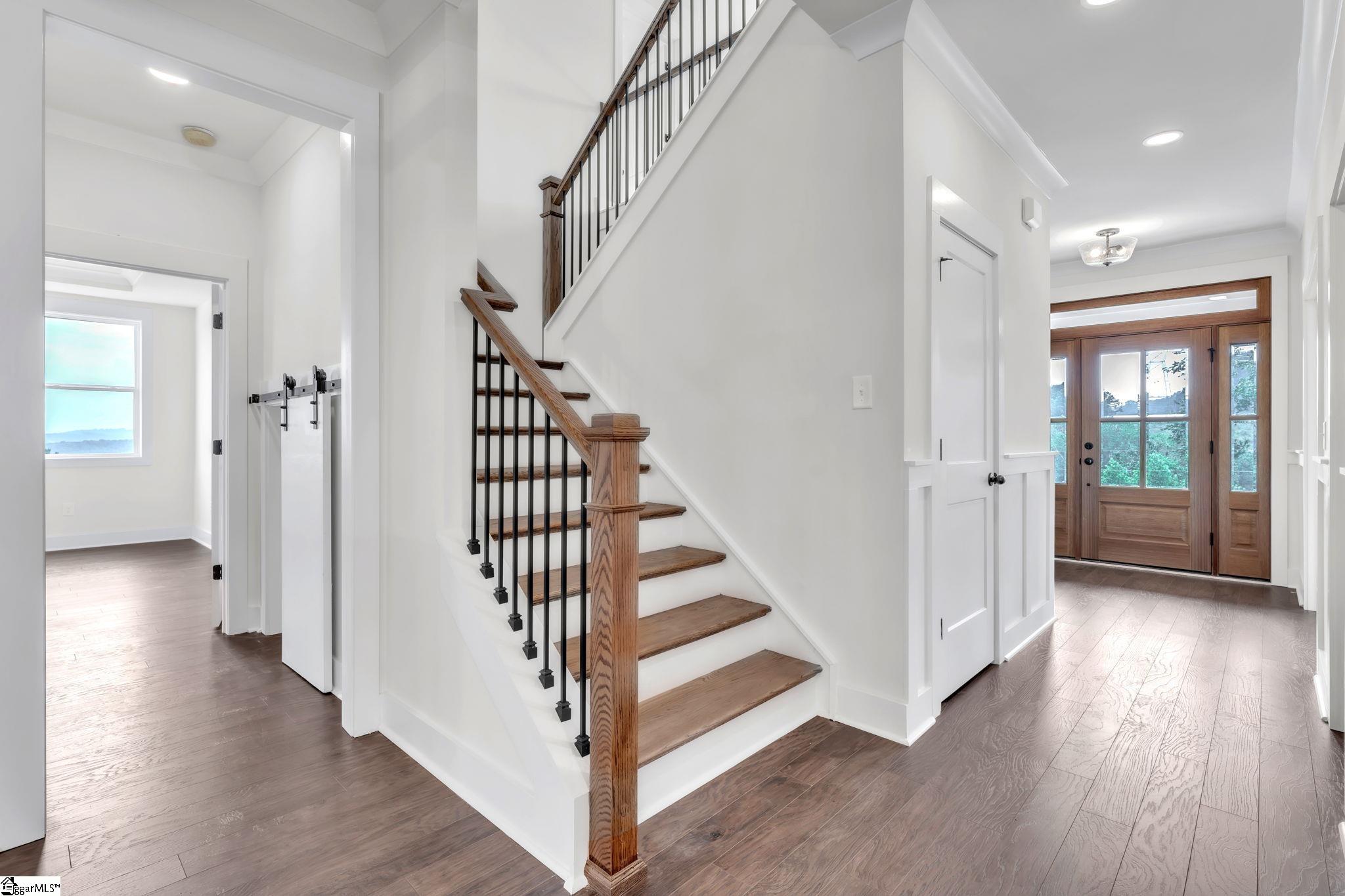 452 North Glassy Mountain Road Landrum, SC 29356 - Photo 7 of 46 hardwood stairs, metal open railing