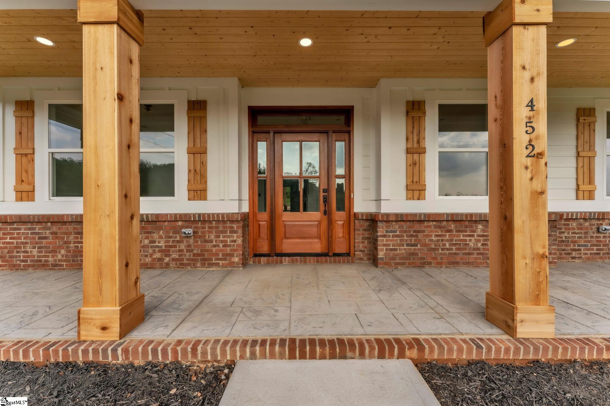 452 North Glassy Mountain Road Landrum, SC 29356 - Photo 10 of 46 cedar columns, mahogany door