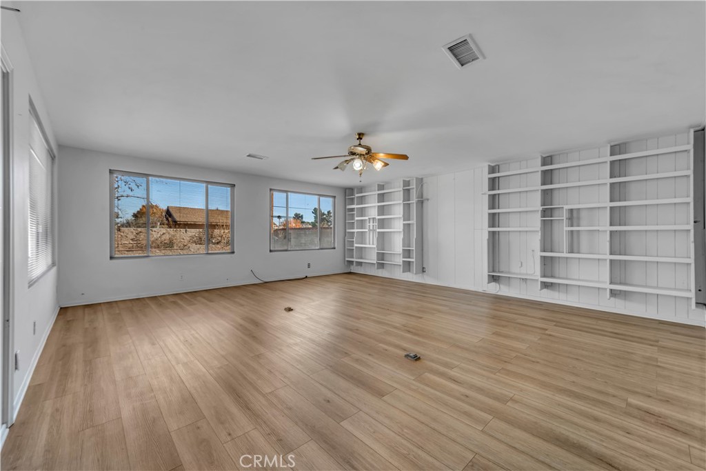 41852 Shain Lane Lancaster, CA 93536 - Photo 12 of 25 wooden floor in an empty room with a window