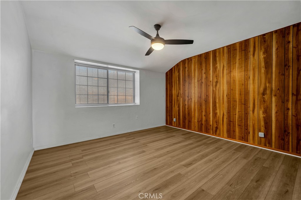 41852 Shain Lane Lancaster, CA 93536 - Photo 16 of 25 a view of an empty room with wooden floor