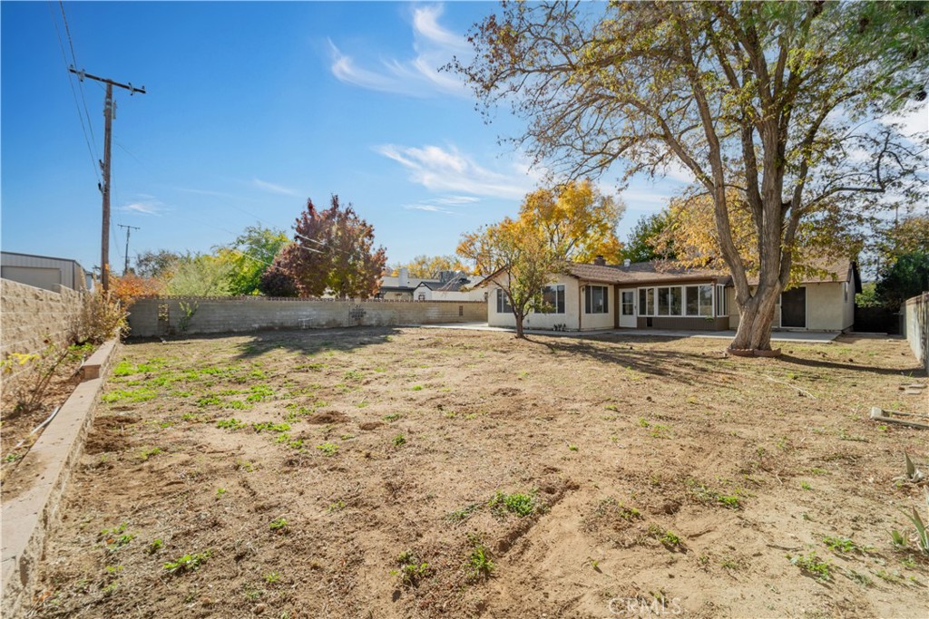 41852 Shain Lane Lancaster, CA 93536 - Photo 21 of 25 a front view of a house with a yard