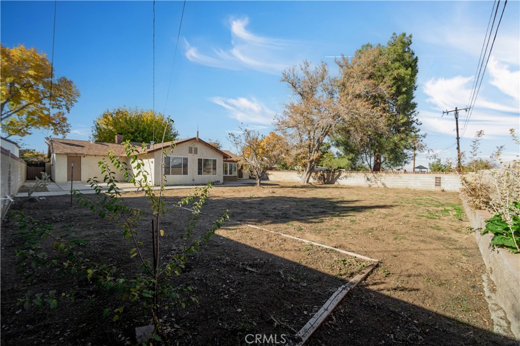 41852 Shain Lane Lancaster, CA 93536 - Photo 22 of 25 a view of a house with a yard