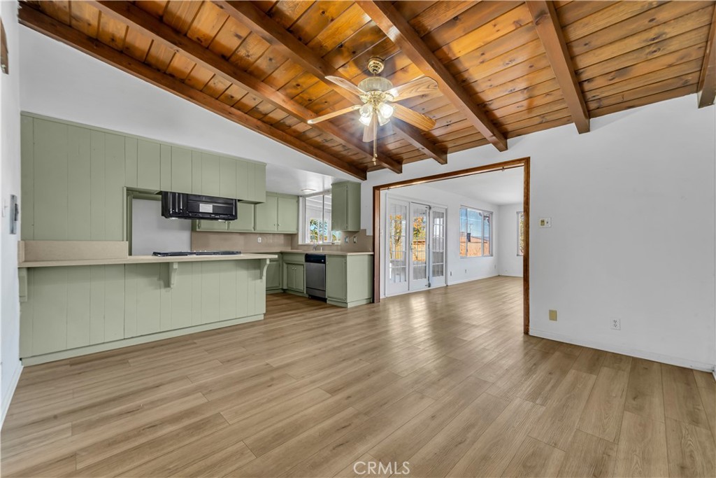 41852 Shain Lane Lancaster, CA 93536 - Photo 7 of 25 a view of a kitchen with wooden floor and a kitchen