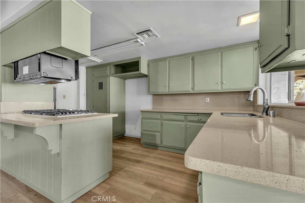 41852 Shain Lane Lancaster, CA 93536 - Photo 9 of 25 a kitchen with cabinets and stainless steel appliances