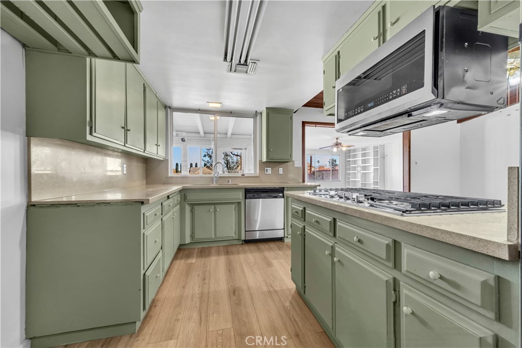 41852 Shain Lane Lancaster, CA 93536 - Photo 10 of 25 a kitchen with stainless steel appliances granite countertop a stove and a sink