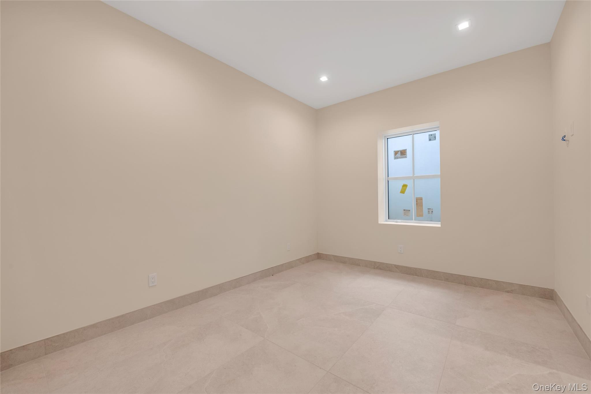 38 Cow Neck Road Sands Point, NY 11050 - Photo 32 of 48 an empty room with a window