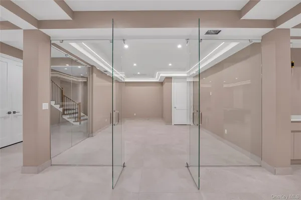 a bathroom with a shower and a glass door