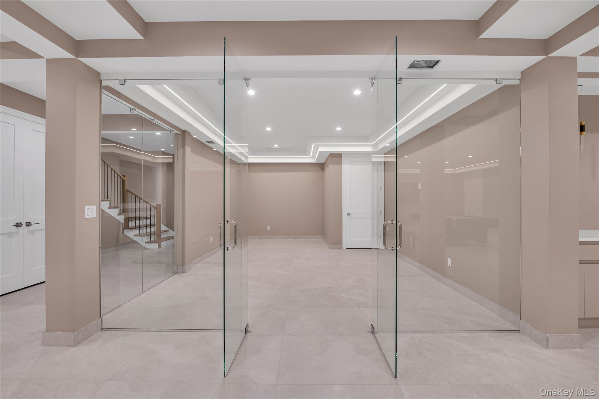 38 Cow Neck Road Sands Point, NY 11050 - Photo 38 of 48 a bathroom with a shower and a glass door