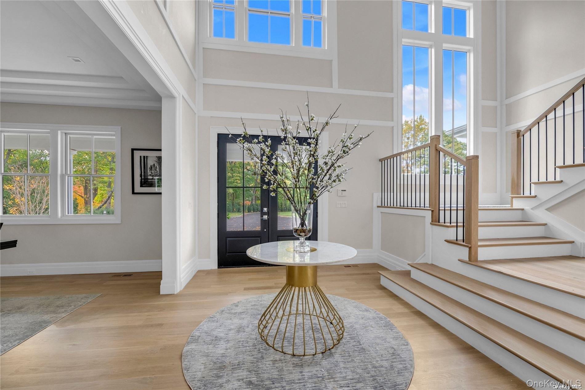 38 Cow Neck Road Sands Point, NY 11050 - Photo 4 of 48 a vase of flowers sitting on a table