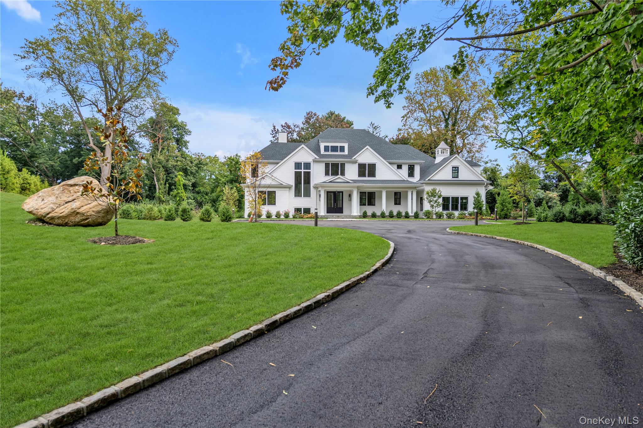 38 Cow Neck Road Sands Point, NY 11050 - Photo 47 of 48 a view of a white house with a big yard plants and large trees