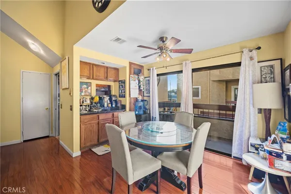 a view of a dining room with furniture window and wooden floor