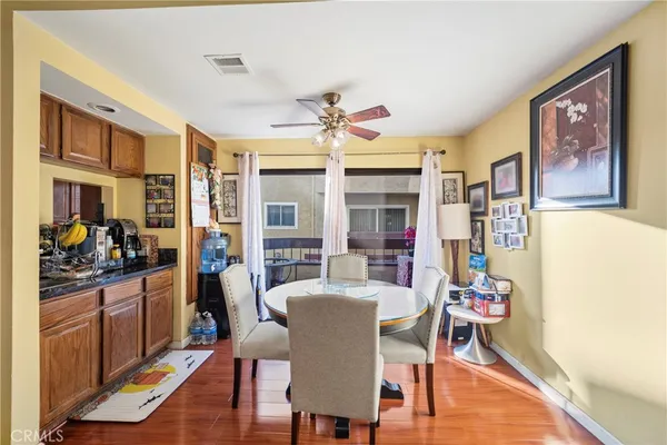 a dining room with furniture and window