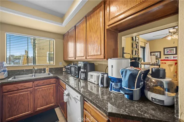 a kitchen with lots of counter space and windows