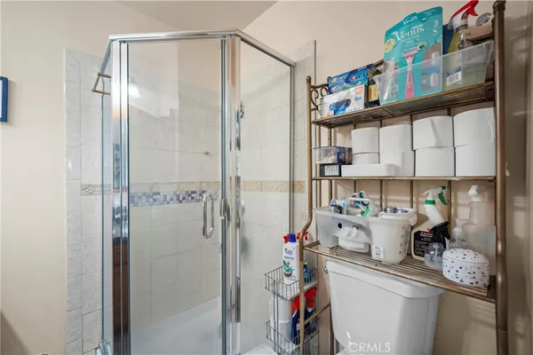 a bathroom with a shower and a sink