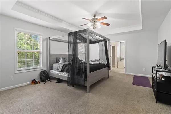 a bed room with furniture and a window