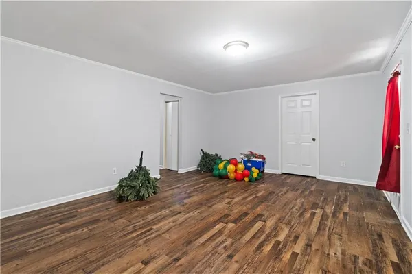 a view of a room with wooden floor and toys