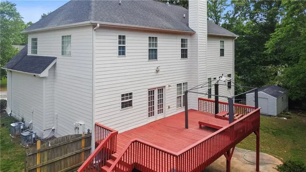 a view of house with a patio