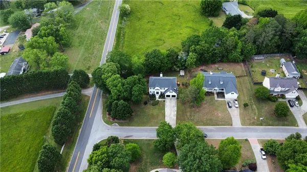 an aerial view of a house with garden space sitting space and swimming pool