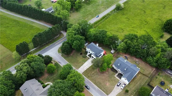 an aerial view of residential house with outdoor space and street view