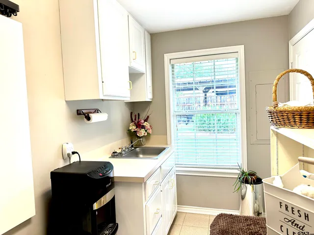 a kitchen with a sink and a window