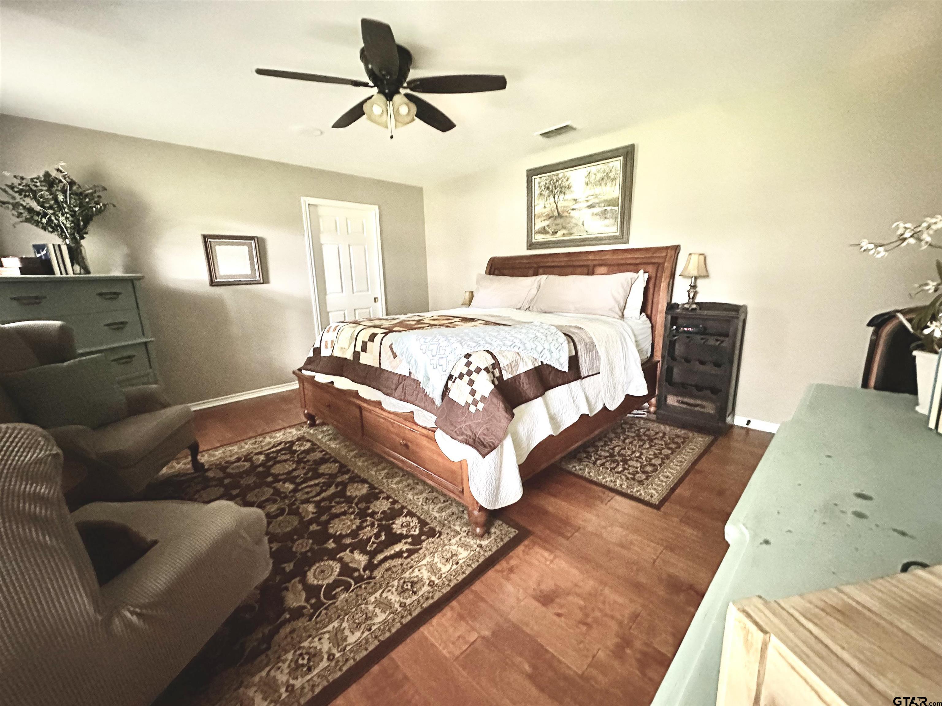 142 Parrish Rusk, TX 75785 - Photo 20 of 48 a bedroom with a bed and wooden floor