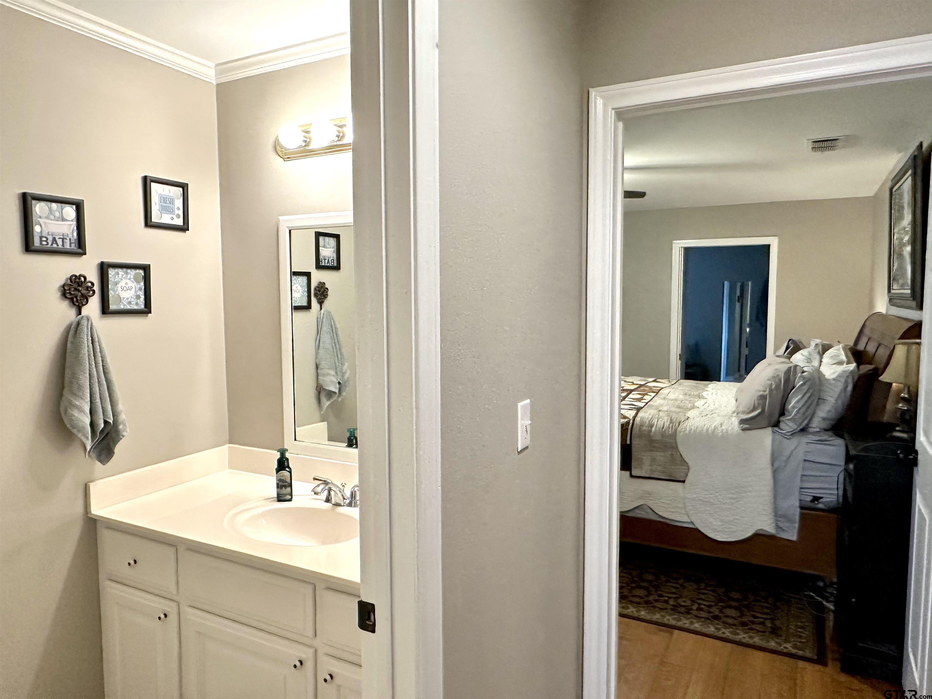 142 Parrish Rusk, TX 75785 - Photo 26 of 48 a en suite bathroom with a sink and a mirror