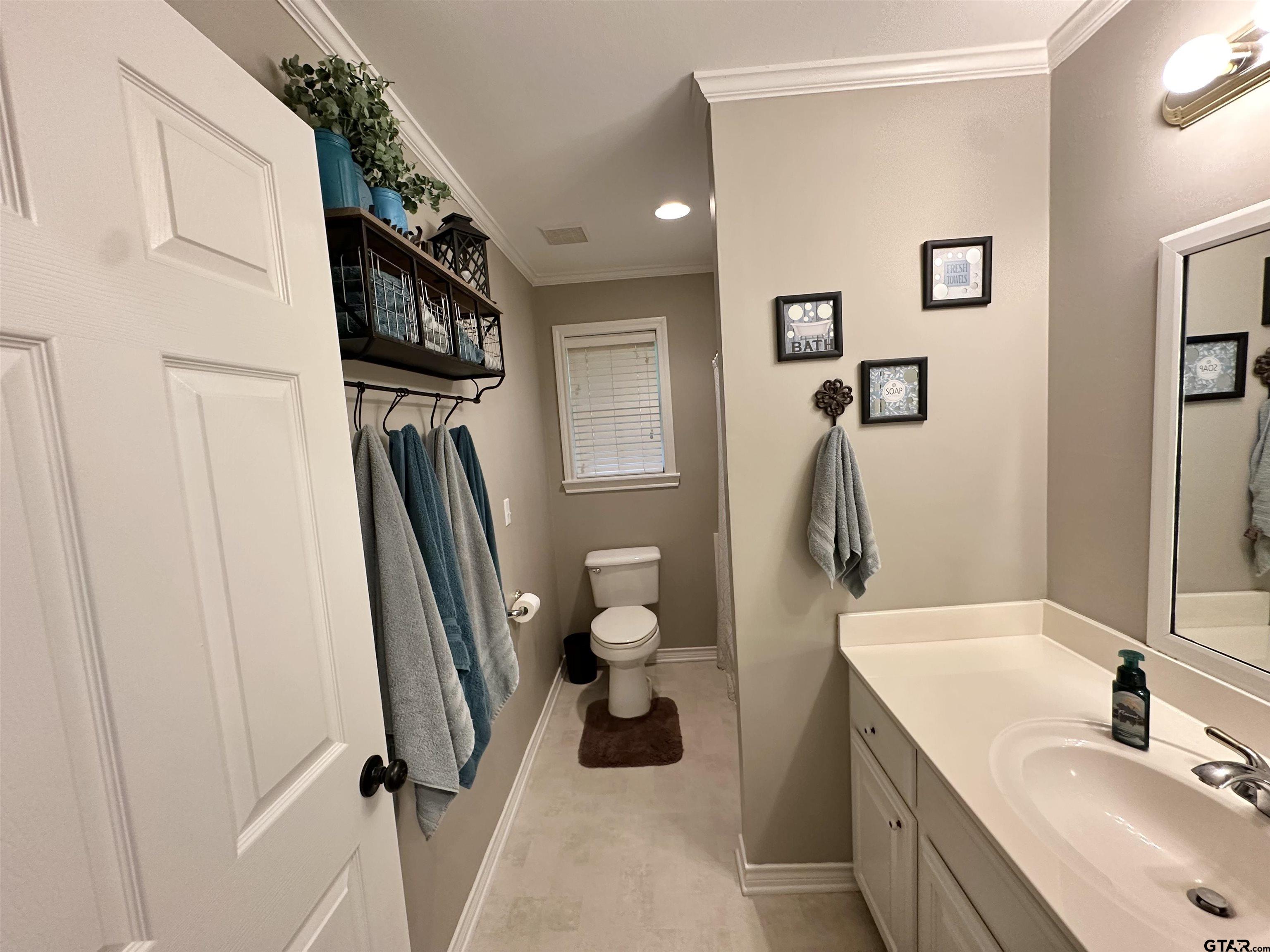 142 Parrish Rusk, TX 75785 - Photo 27 of 48 a bathroom with a toilet sink and mirror