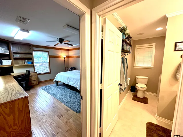 a view of living room with furniture and a wooden floor