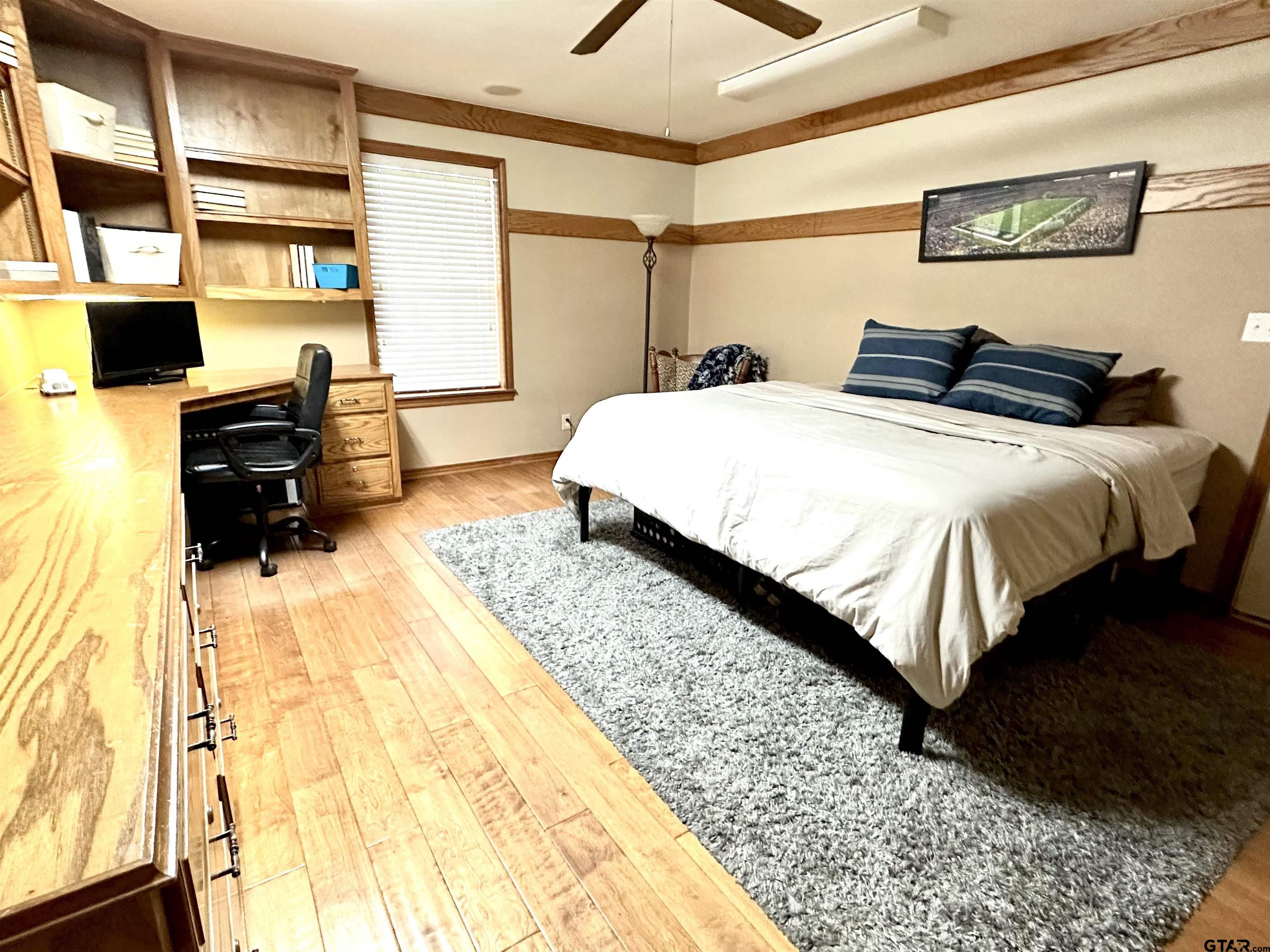 142 Parrish Rusk, TX 75785 - Photo 30 of 48 a bedroom with a bed and wooden floor