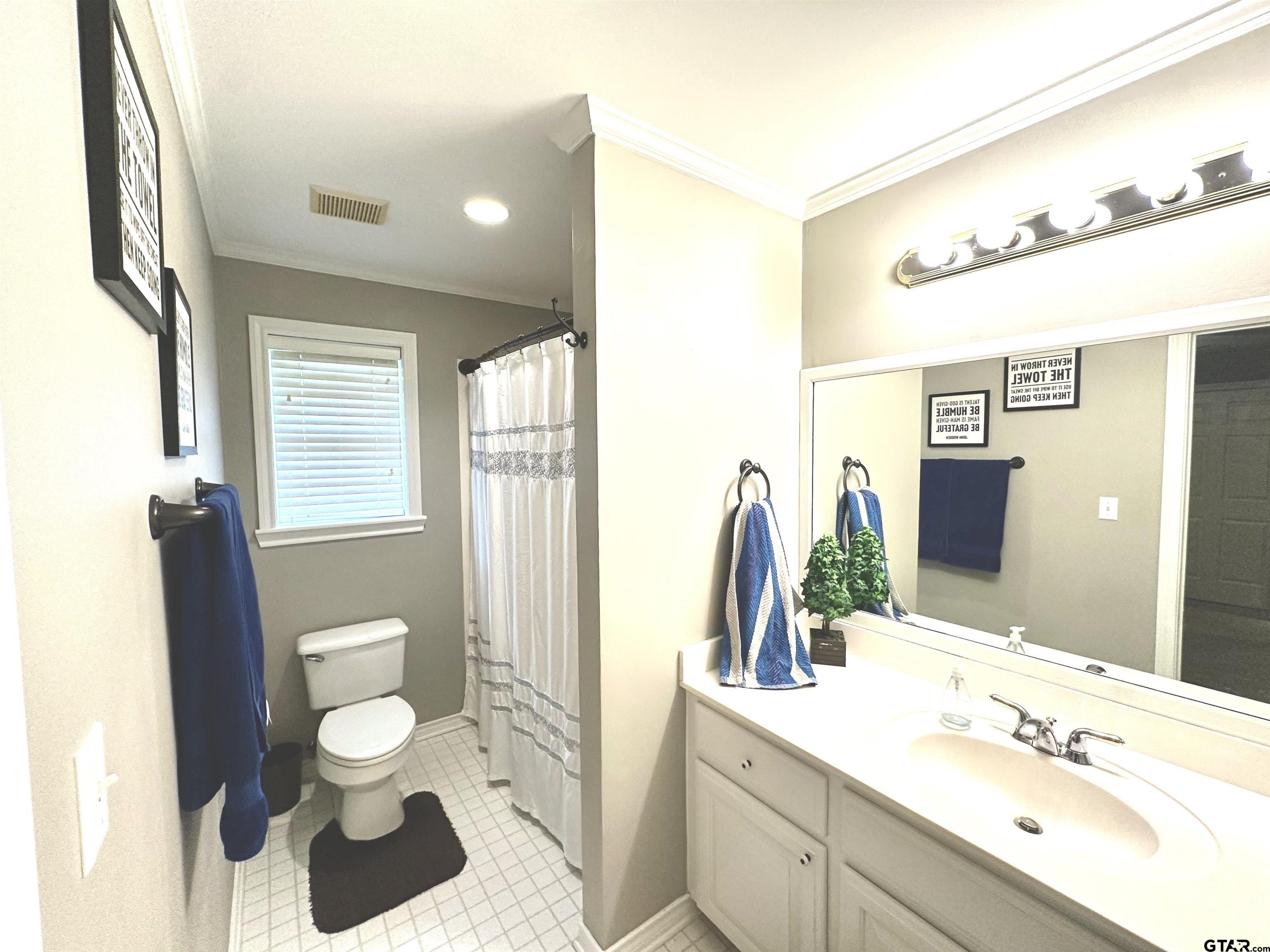 142 Parrish Rusk, TX 75785 - Photo 36 of 48 a bathroom with a sink a toilet and a mirror