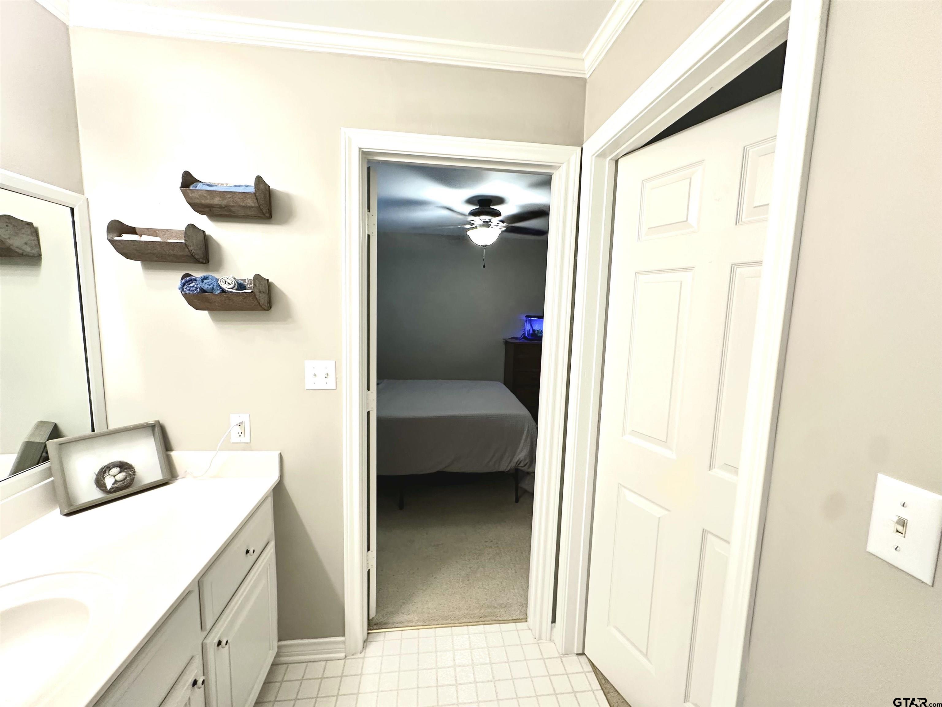 142 Parrish Rusk, TX 75785 - Photo 37 of 48 a en suite bathroom with a granite countertop sink and a mirror