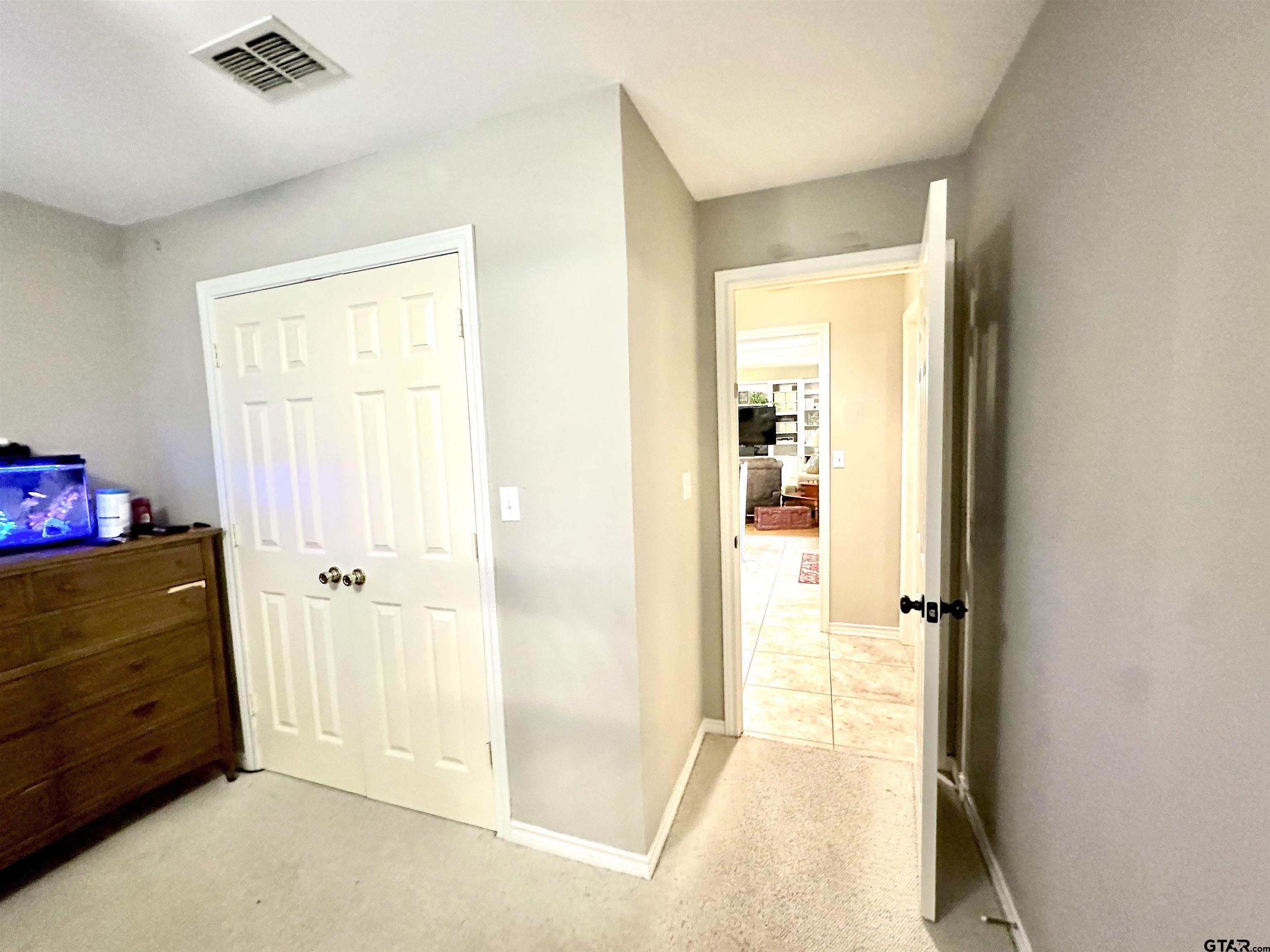 142 Parrish Rusk, TX 75785 - Photo 40 of 48 a view of a bedroom with wooden floor and closet