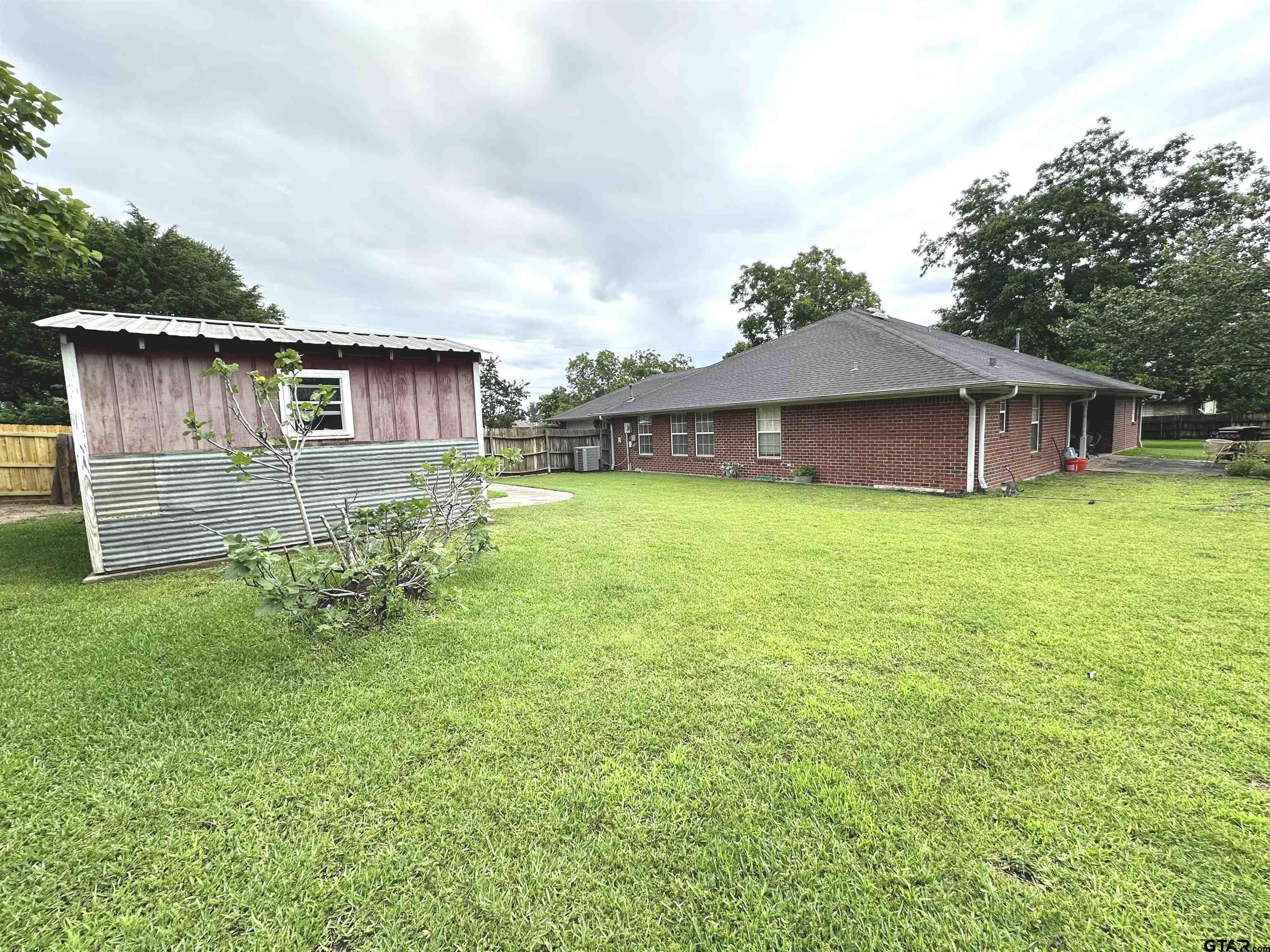 142 Parrish Rusk, TX 75785 - Photo 46 of 48 a view of a house with a yard and sitting area