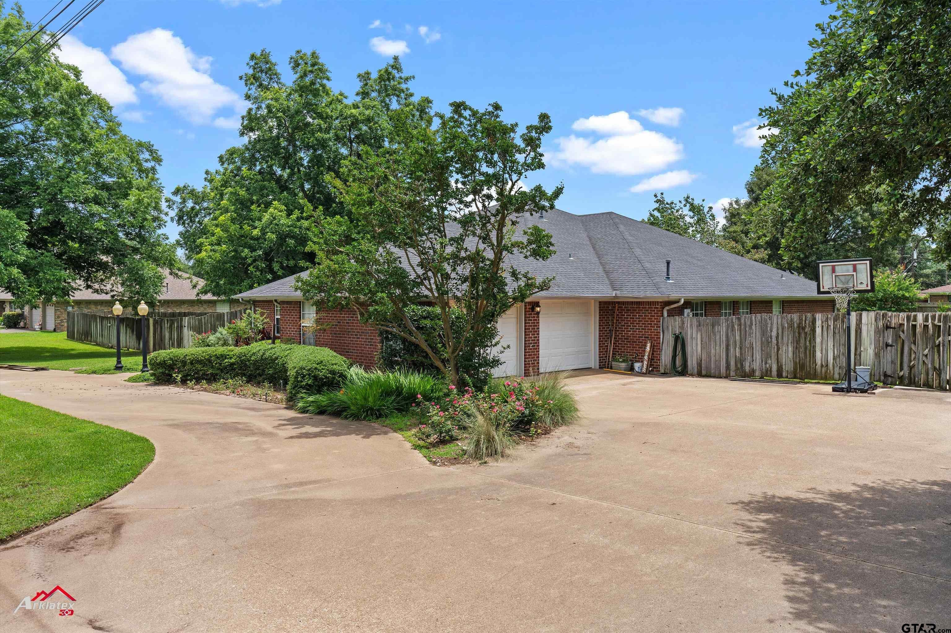 142 Parrish Rusk, TX 75785 - Photo 7 of 48 a front view of a house with a yard and a garage