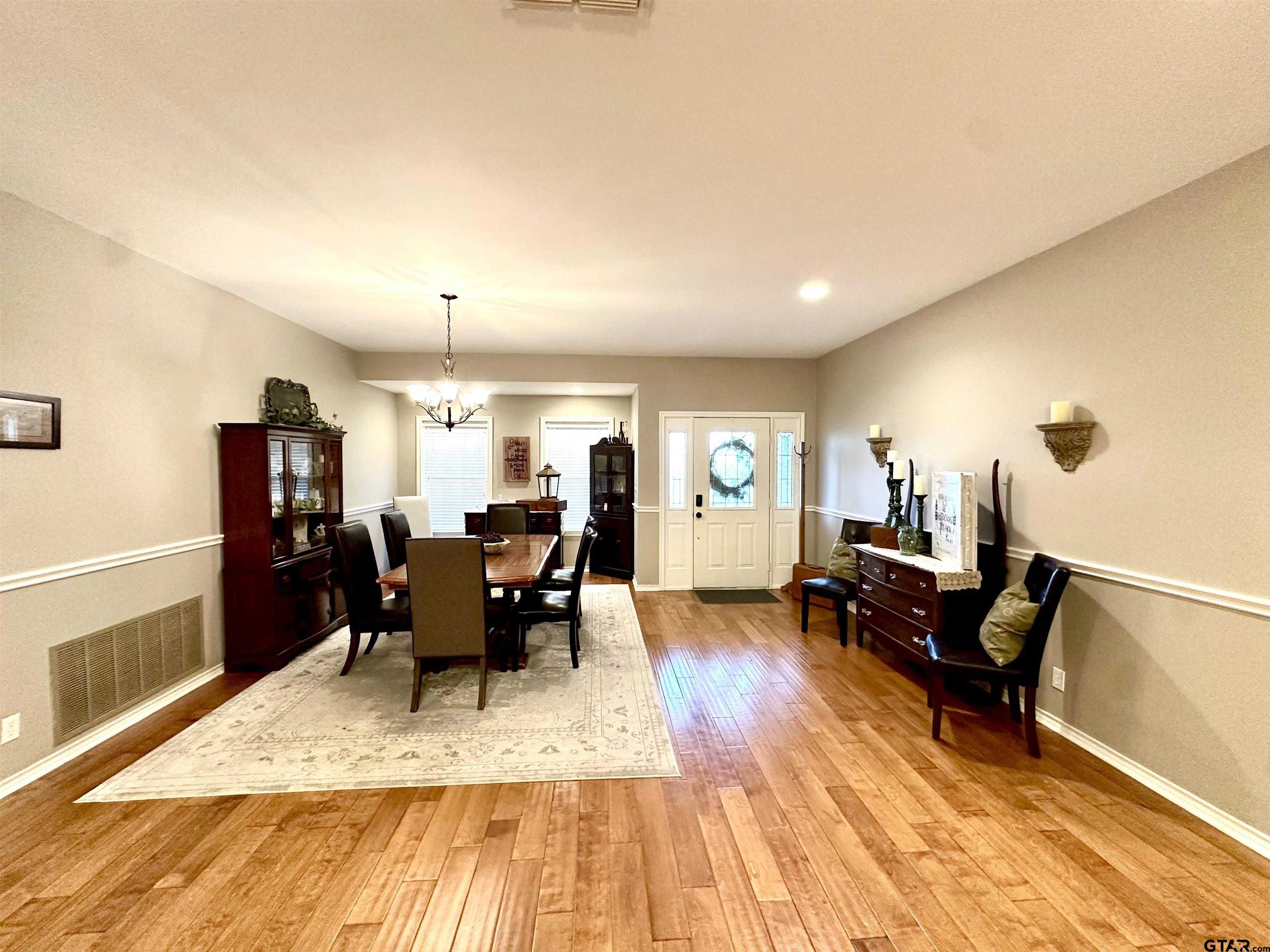 142 Parrish Rusk, TX 75785 - Photo 10 of 48 a living room with furniture a dining table and wooden floor