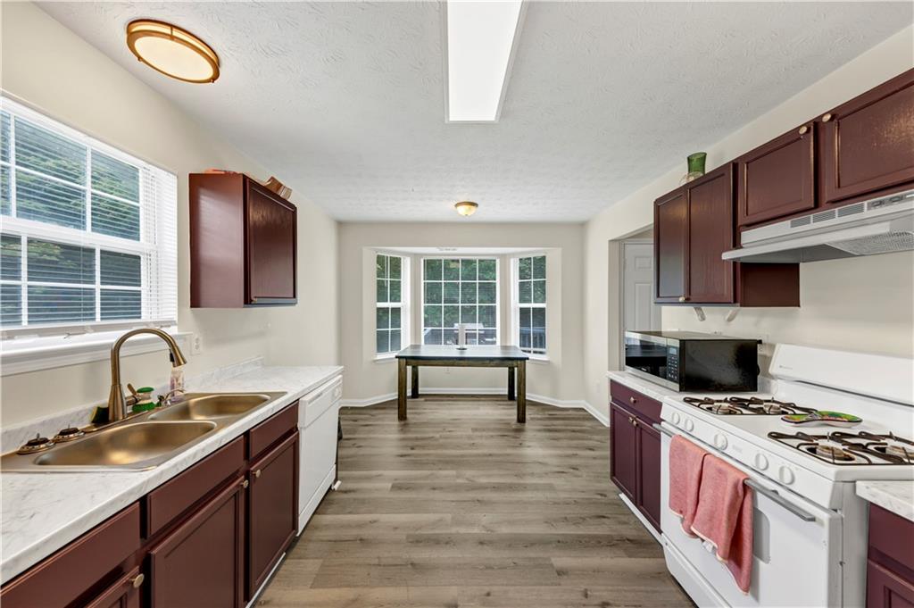 2880 Field Spring Drive Lithonia, GA 30058 - Photo 15 of 31 a kitchen with a stove and a sink