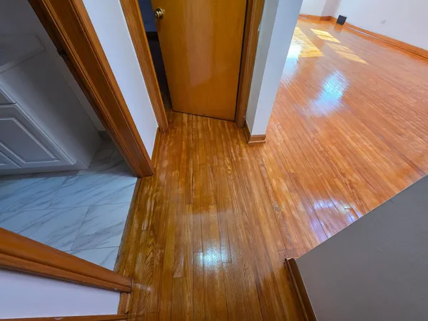 a view of balcony with wooden floor
