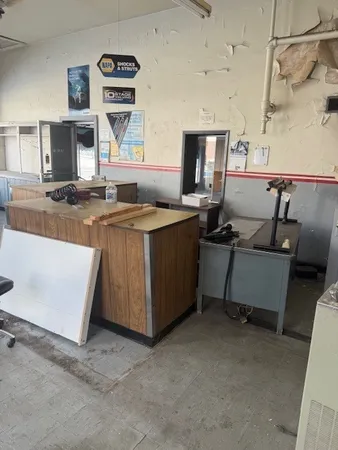 a kitchen with a sink stove and cabinets
