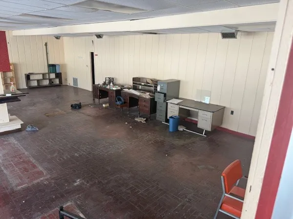 a view of a workspace with furniture