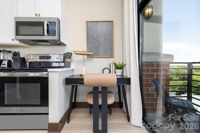 a kitchen with a sink and a stove top oven