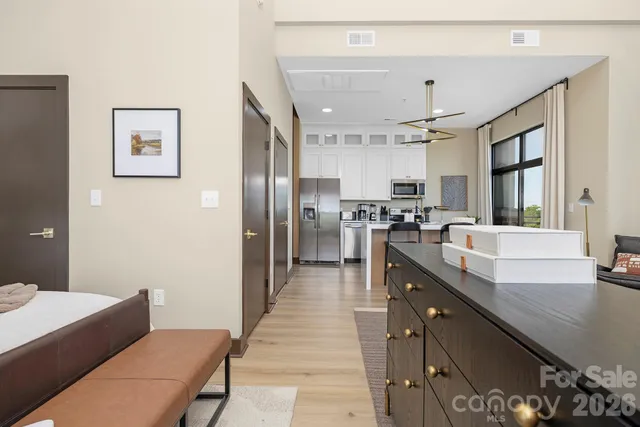 a large kitchen with stainless steel appliances lots of counter top space