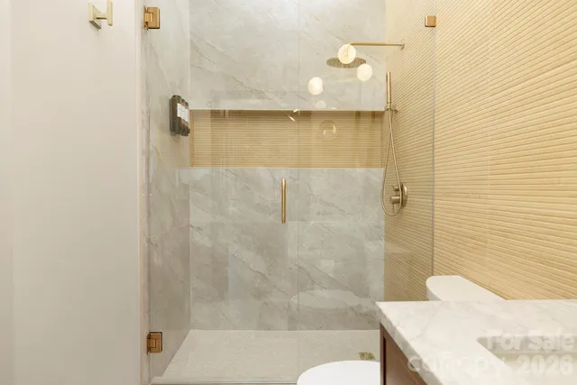 a bathroom with a sink and shower