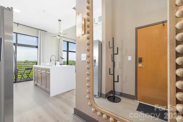 a kitchen with a refrigerator and a stove