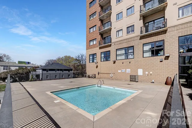 a view of a patio with a table and chairs