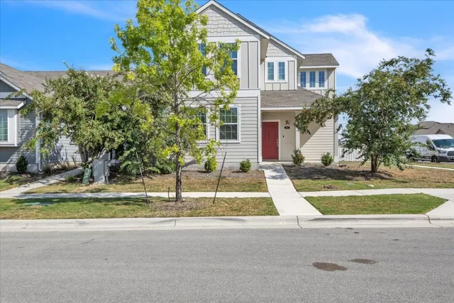 a house with yard in front of it