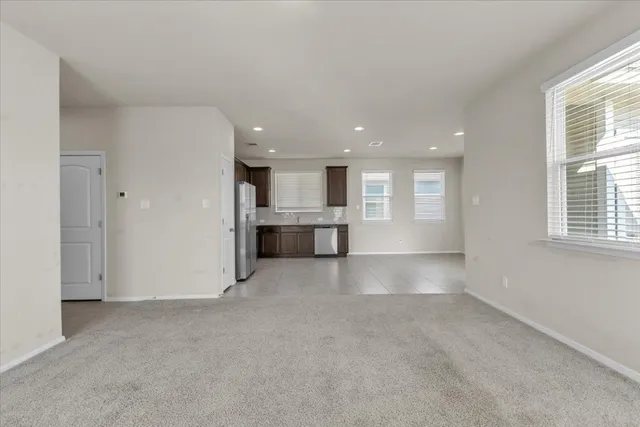 a view of a kitchen with a sink and a window